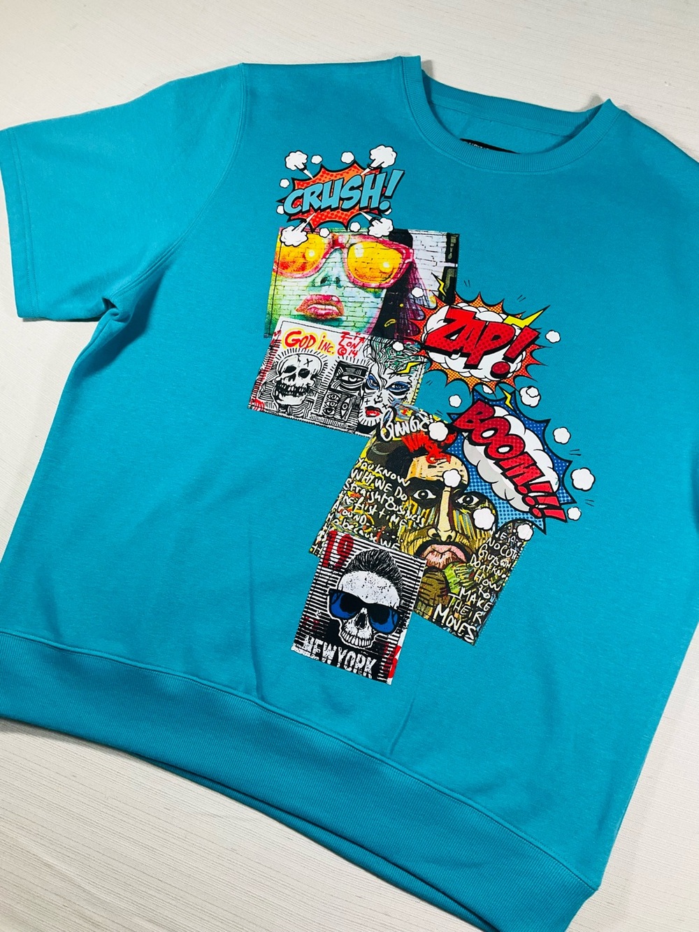 NWOT RUTHERFORD Mens Oversized Comic Punk Turquoise Short Sleeve Crew Sweatshir